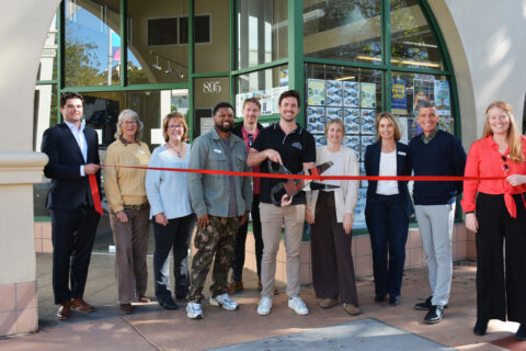 group photo of ribbon cutting celebration with B. Remarkable Media in front of the SLO Chamber in San Luis Obispo